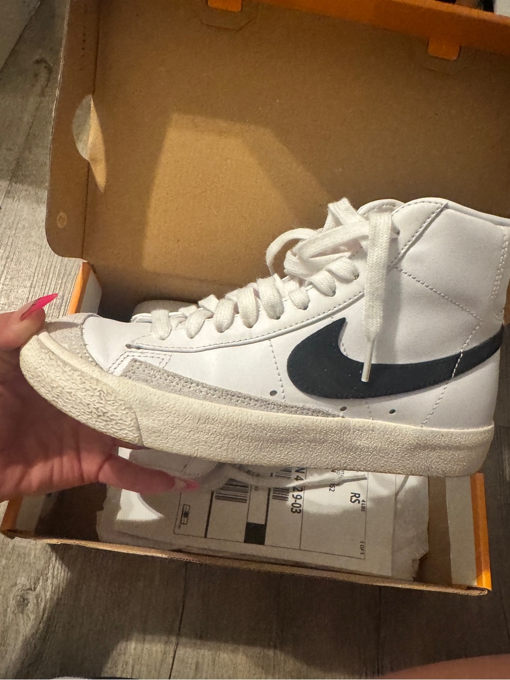 Nike White High-Top Sneakers with Black Swoosh